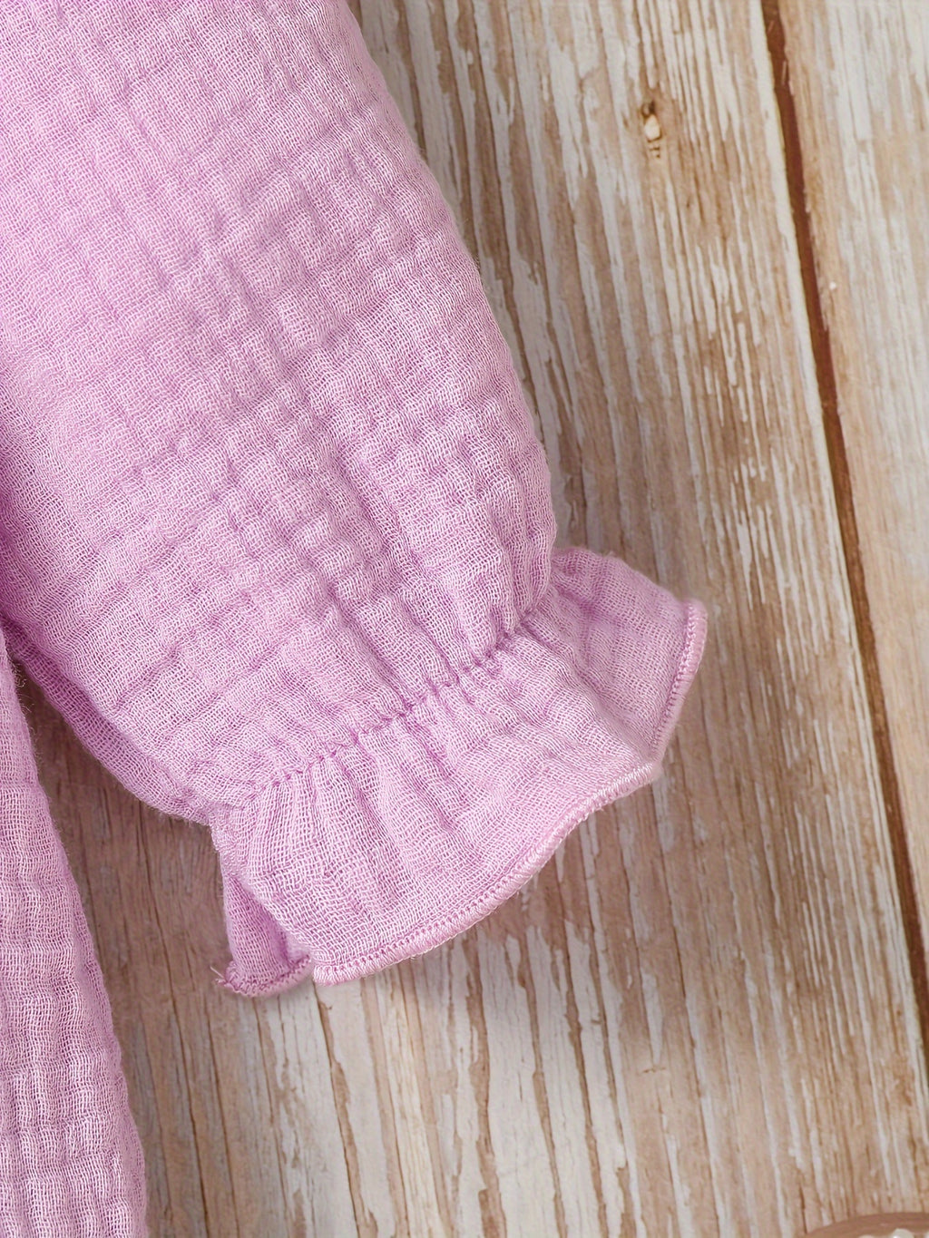Newborn muslin bodysuit