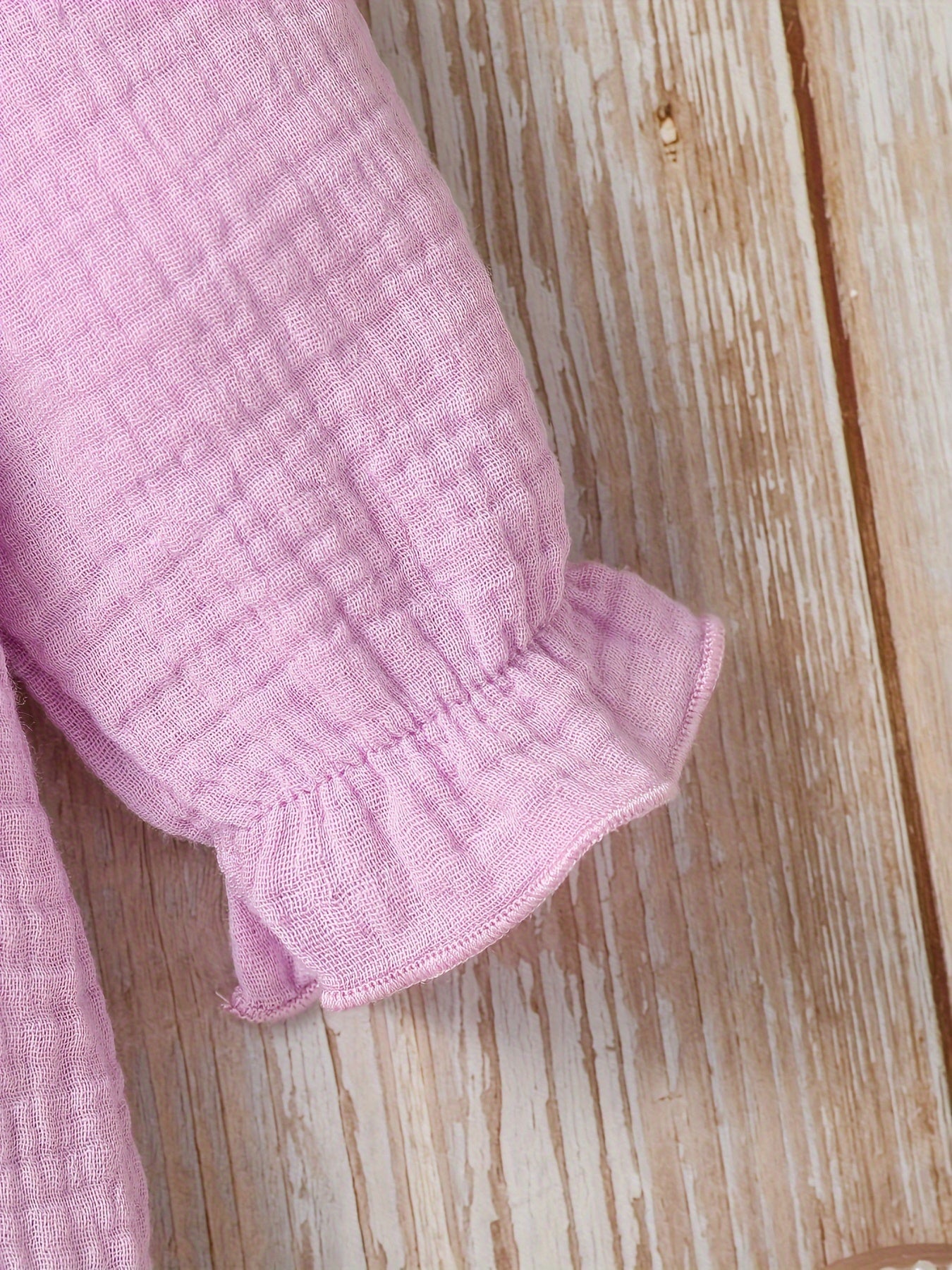 Newborn muslin bodysuit